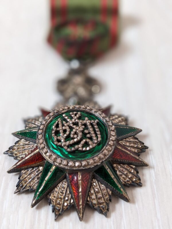 Nichan Iftikhar order with green enameled center